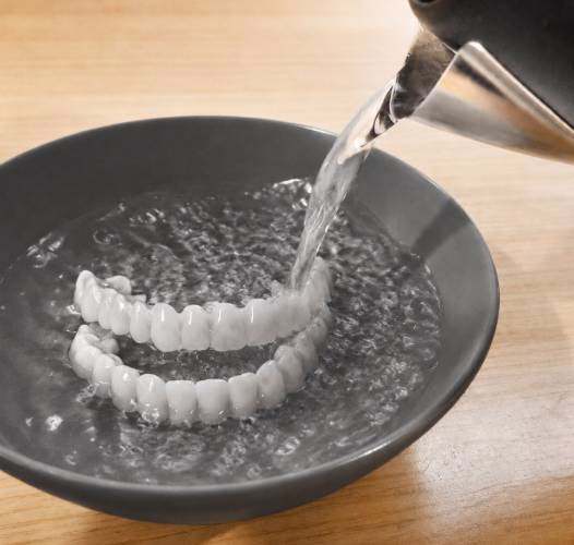 Step 1: warm the WellaSmile shell in warm water